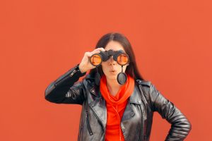 Woman looking into binoculars 