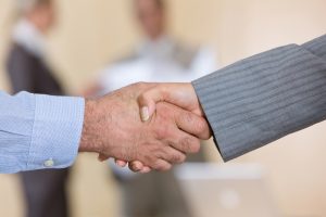 Two business people shaking hands