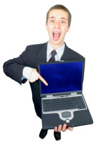 Businessman pointing to his laptop in an exciting manner