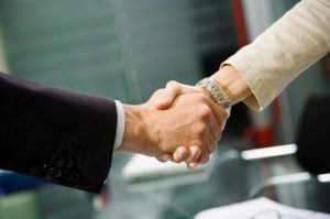 Two business people shaking hands