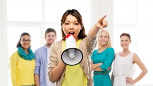 Woman leader speaking into a megaphone