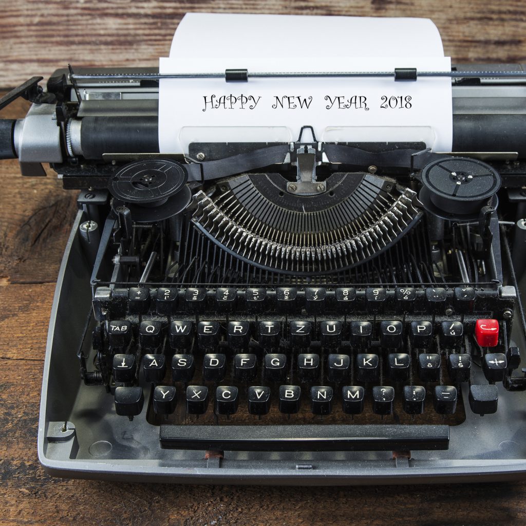 Typewriter with the words "HAPPY NEW YEAR 2018" coming out of the top